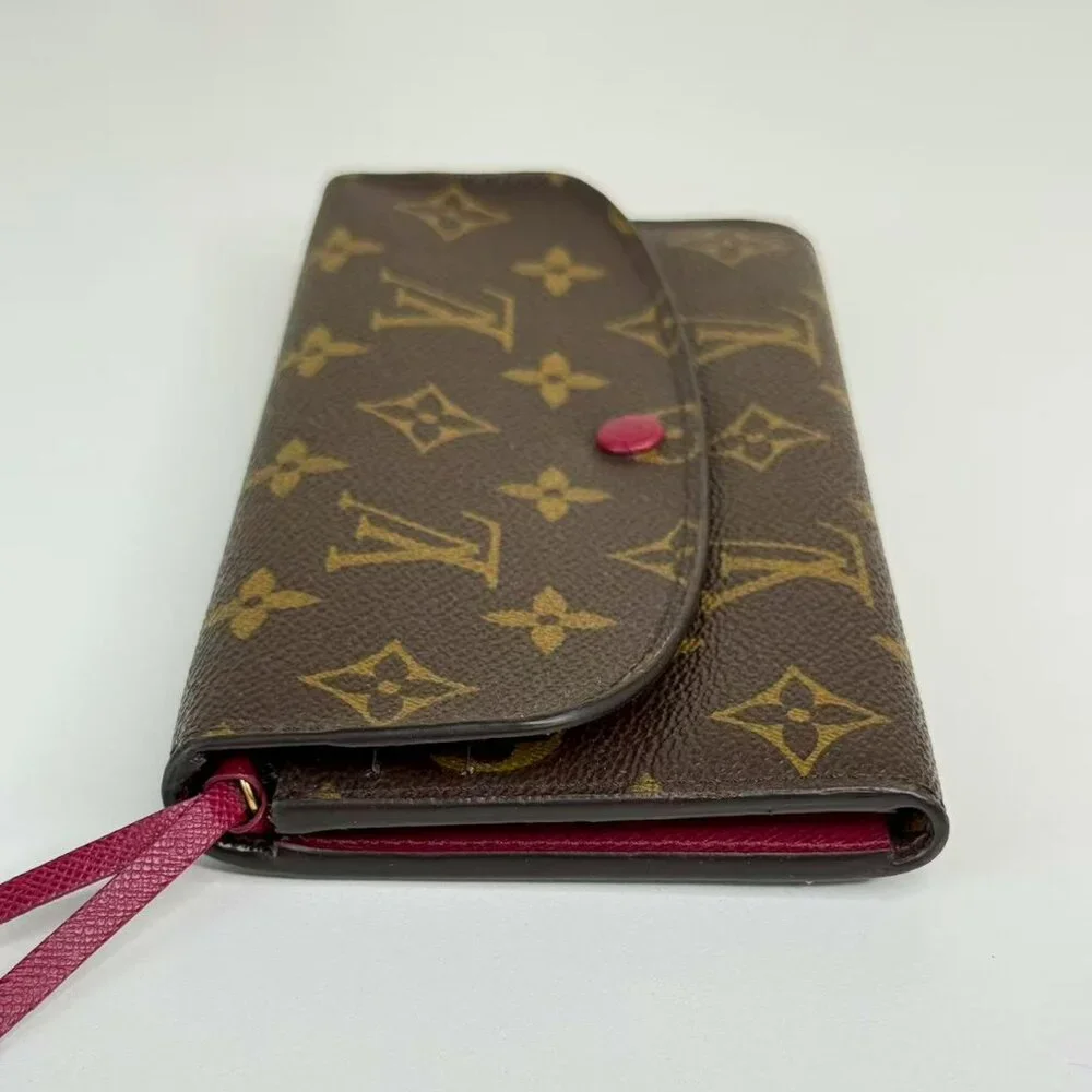 Louis Vuitton Monogram Canvas Wallet with Classic LV Pattern and Red Button